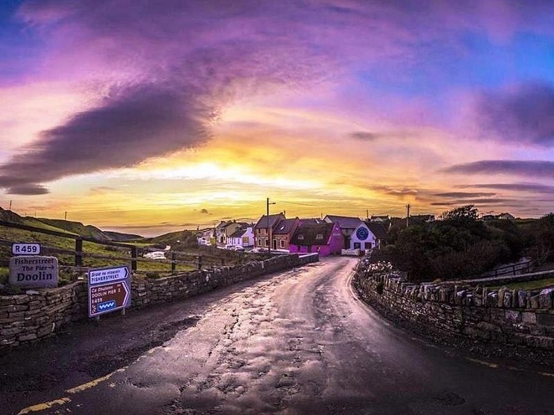 The road into Doolin at dusk, the signpost at the junction